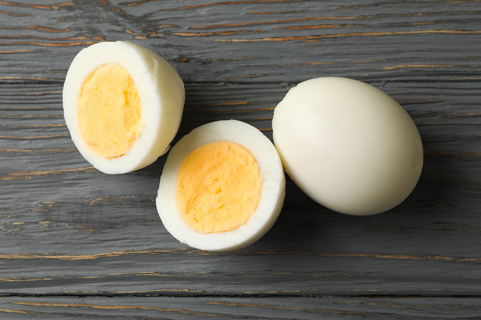 bigstock-Hard-Boiled-Eggs-On-Wooden-Bac-392051996
