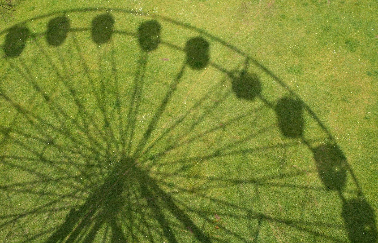 bigstock-Shadow-Of-Ferris-Wheel-fairgr-254773570
